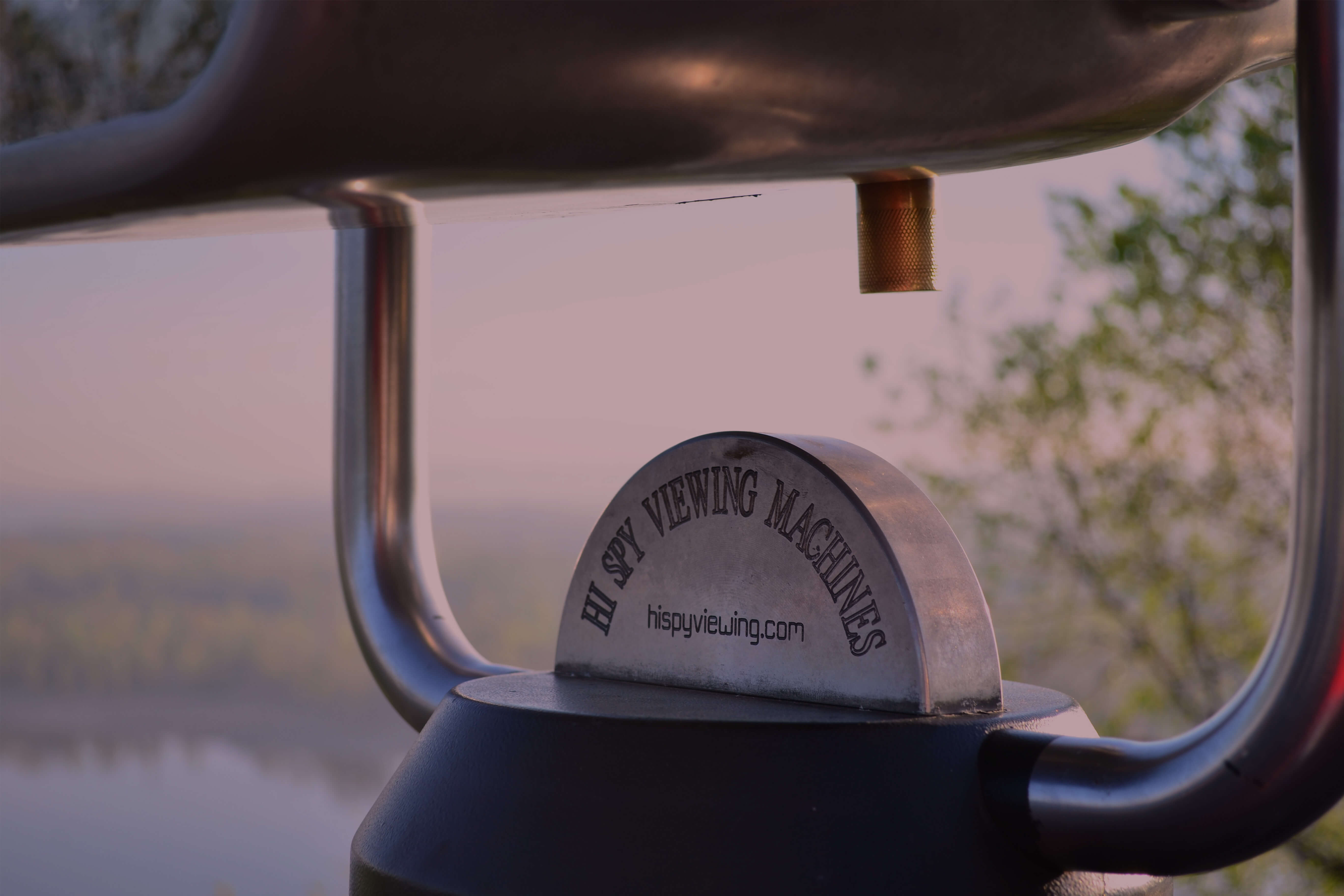 A branded hi spy viewing machine over a nice landscape.